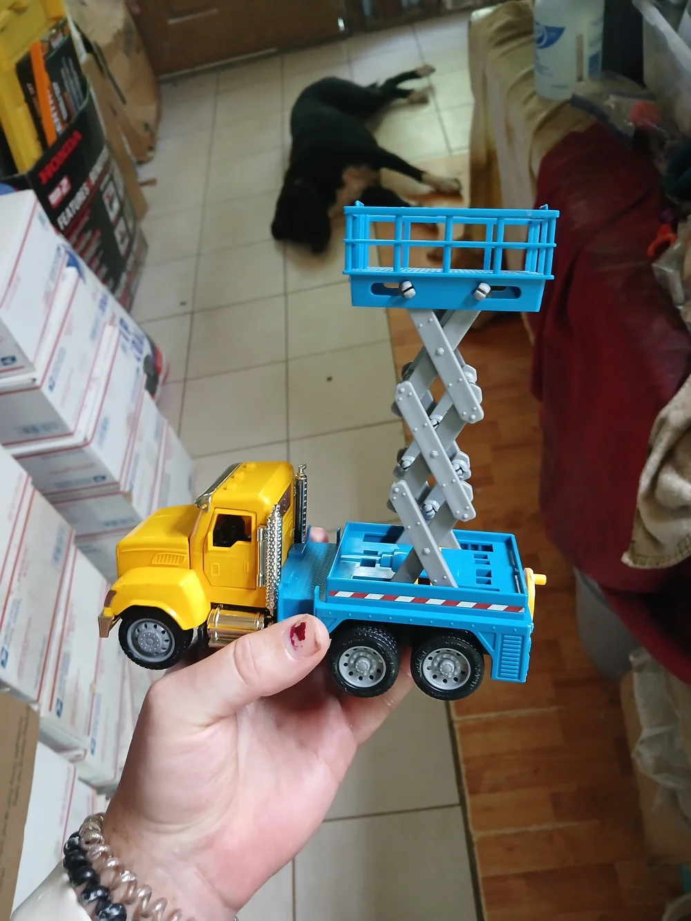 toy is a Driven by Battat Micro Series Scissor Lift Truck.